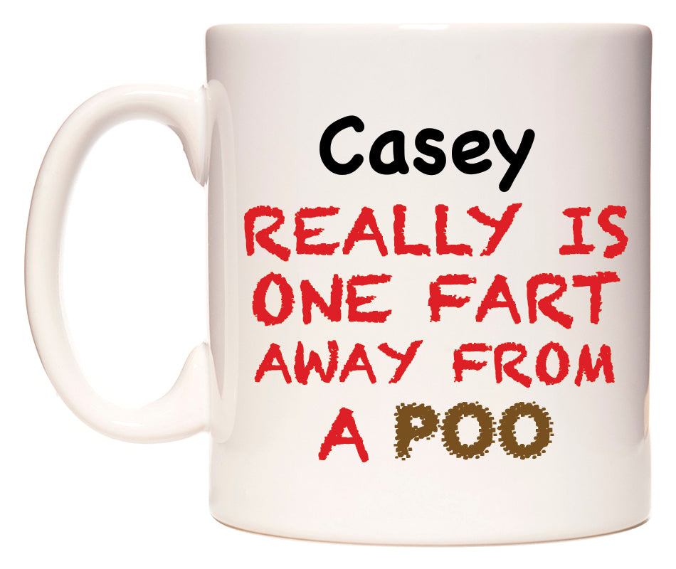 This mug features Casey Really is ONE Fart Away from A Poo