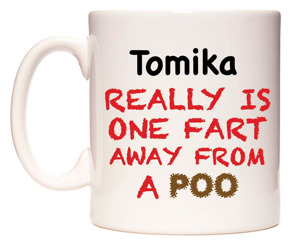 This mug features Tomika Really is ONE Fart Away from A Poo