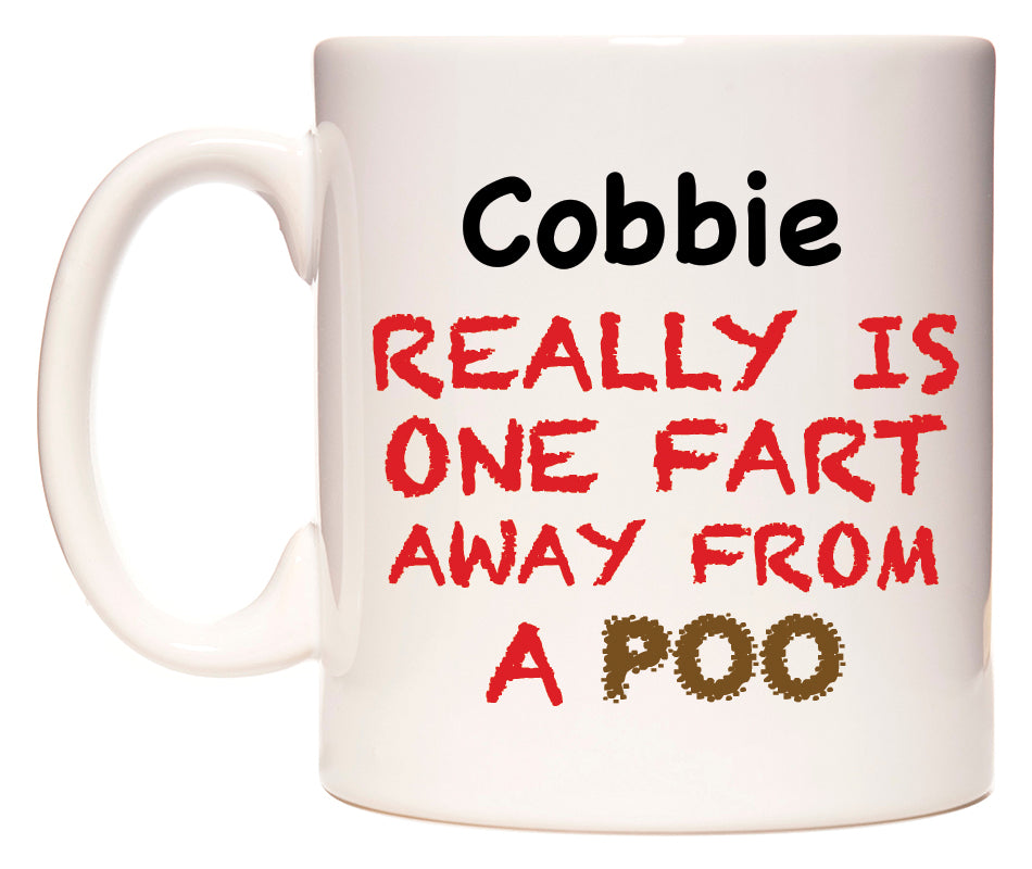This mug features Cobbie Really is ONE Fart Away from A Poo