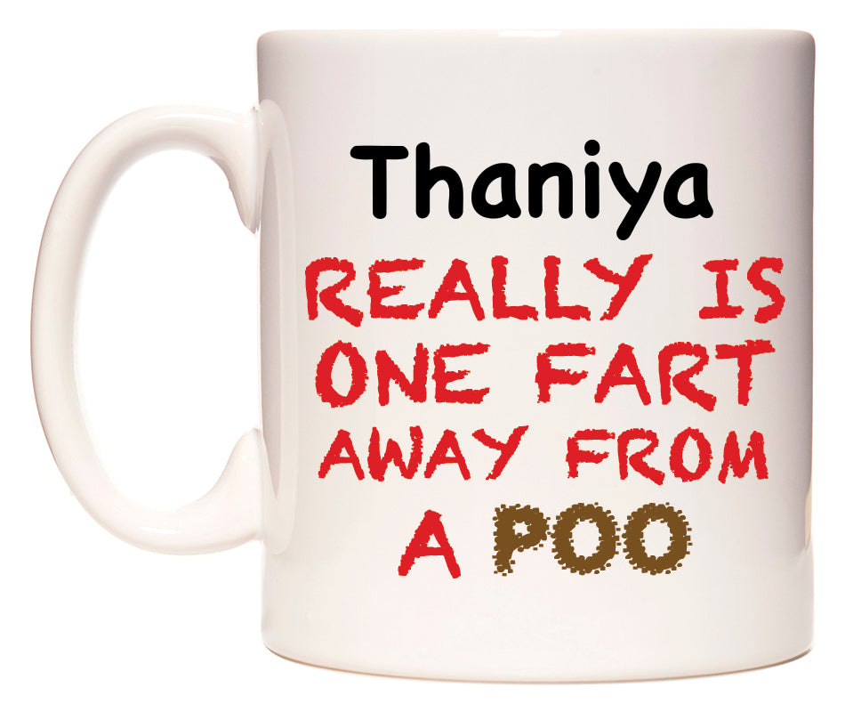 This mug features Thaniya Really is ONE Fart Away from A Poo